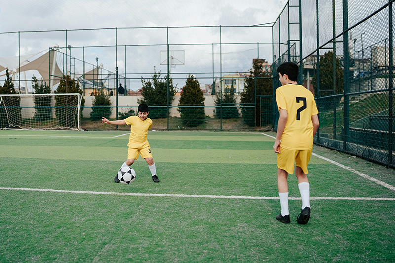 playing football in field