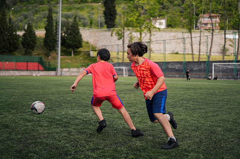 students playing football