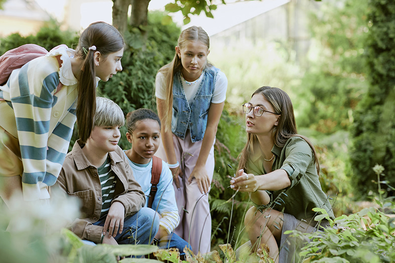 students learning biology outdoors