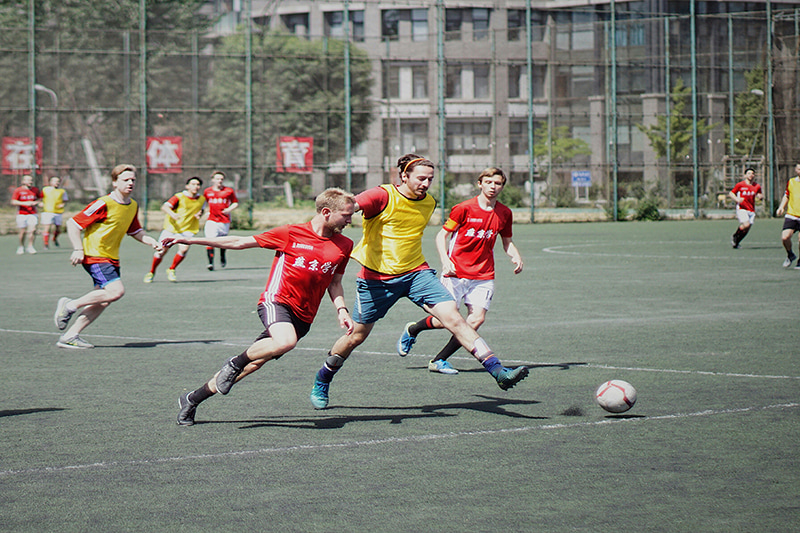 students playing football