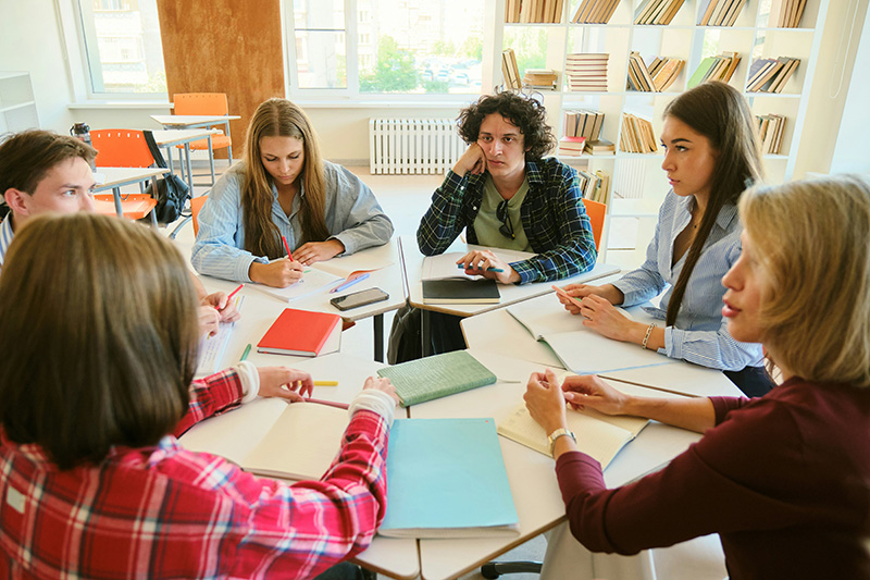 students sharing group work in school